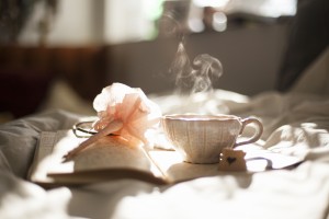 Teacup, book and pen. Photo by Carli Jean via Unsplash
