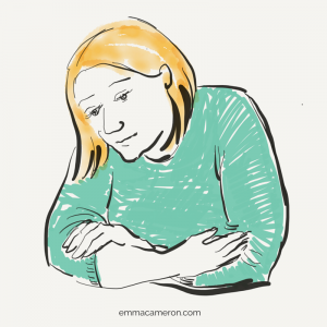 Woman with arms crossed, looking thoughtful, has feelings about infertility